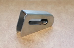 Spring in handle, retaining plate for spring to be welded in